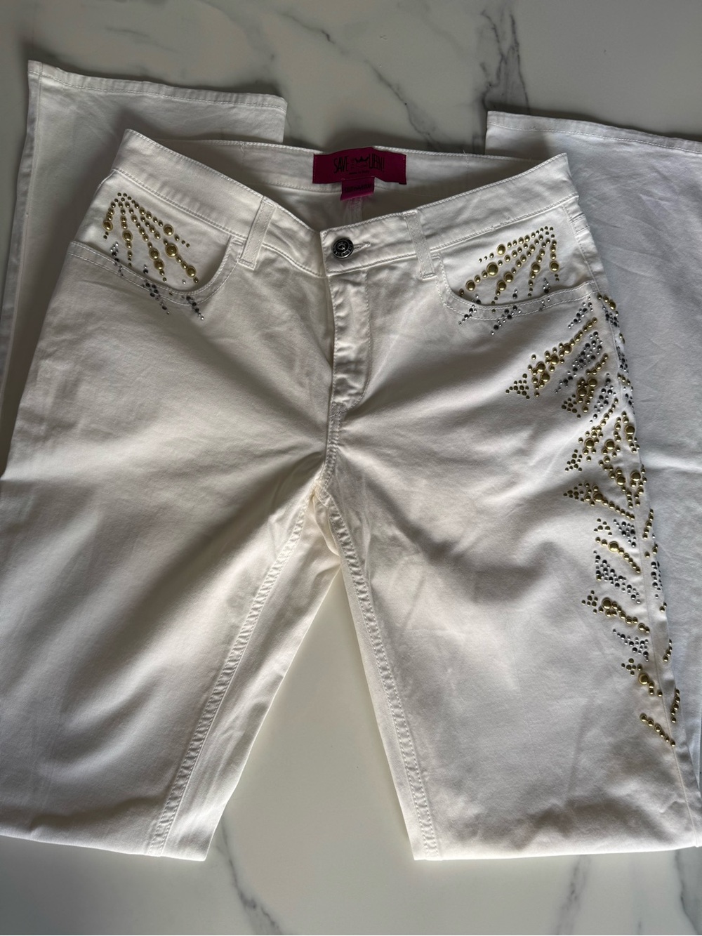 Save The Queen White Straight Leg Jeans with Gold & Silver Studs.